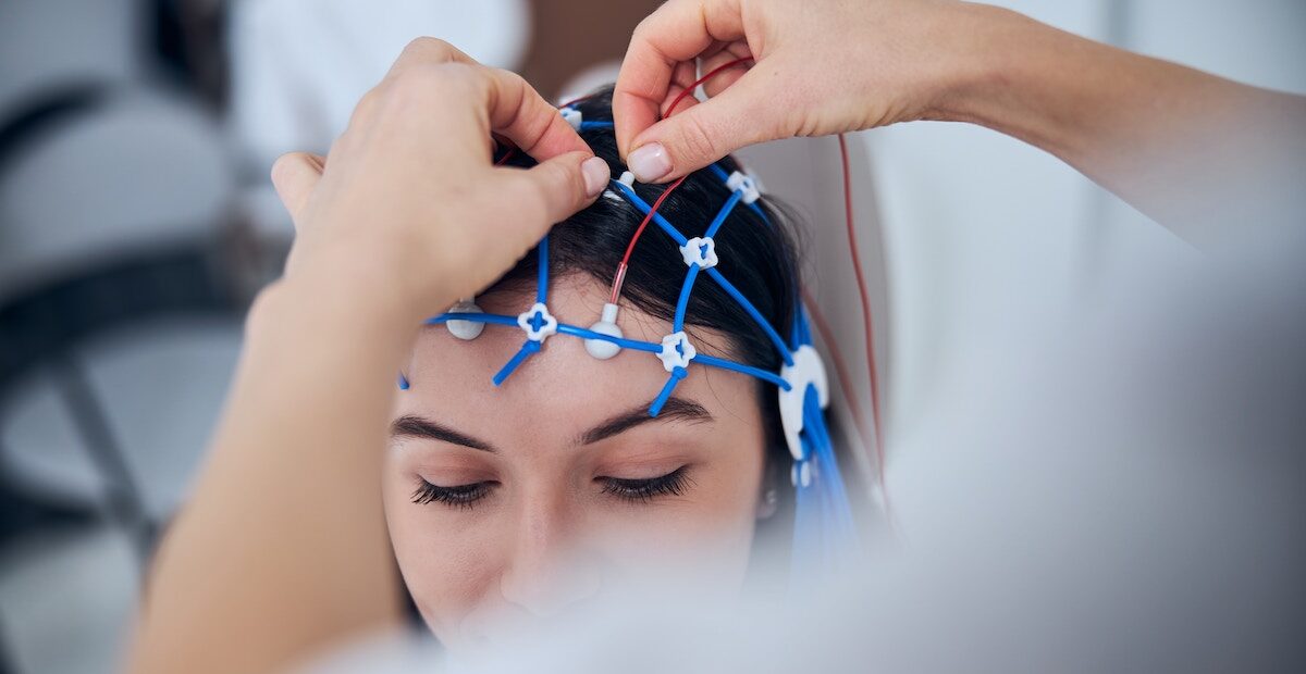 Woman receiving an EEG as part of MeRT treatment