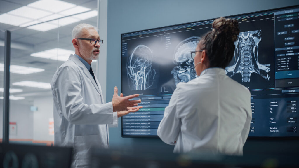 scientist and doctor reviewing brain function