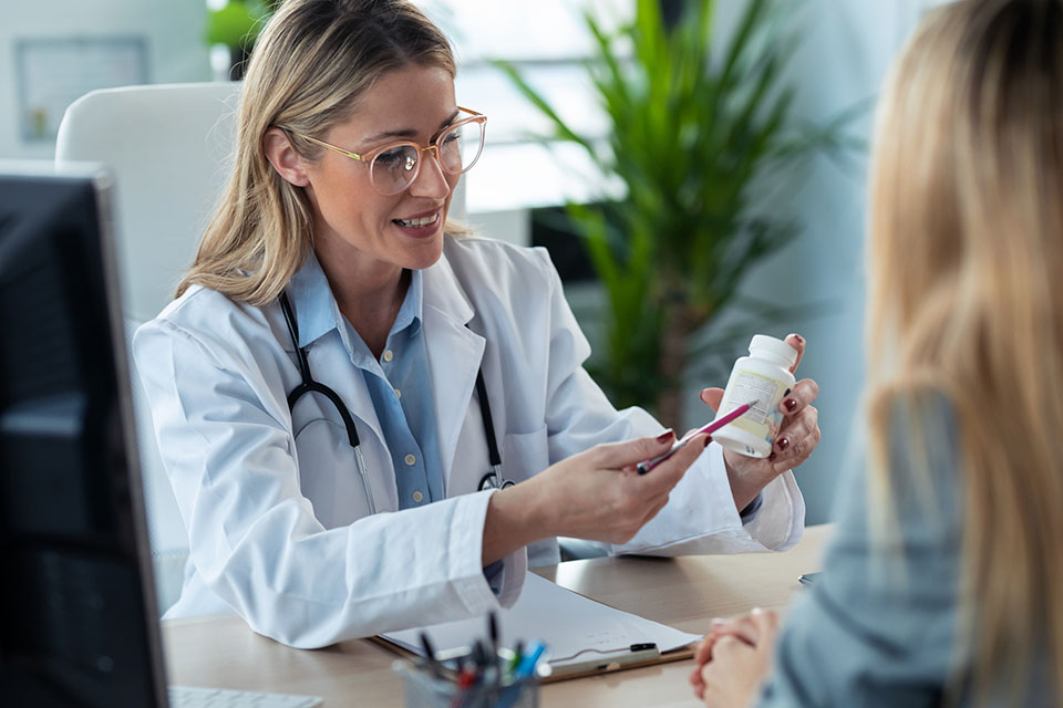 functional medicine doctor giving a supplement to a patient