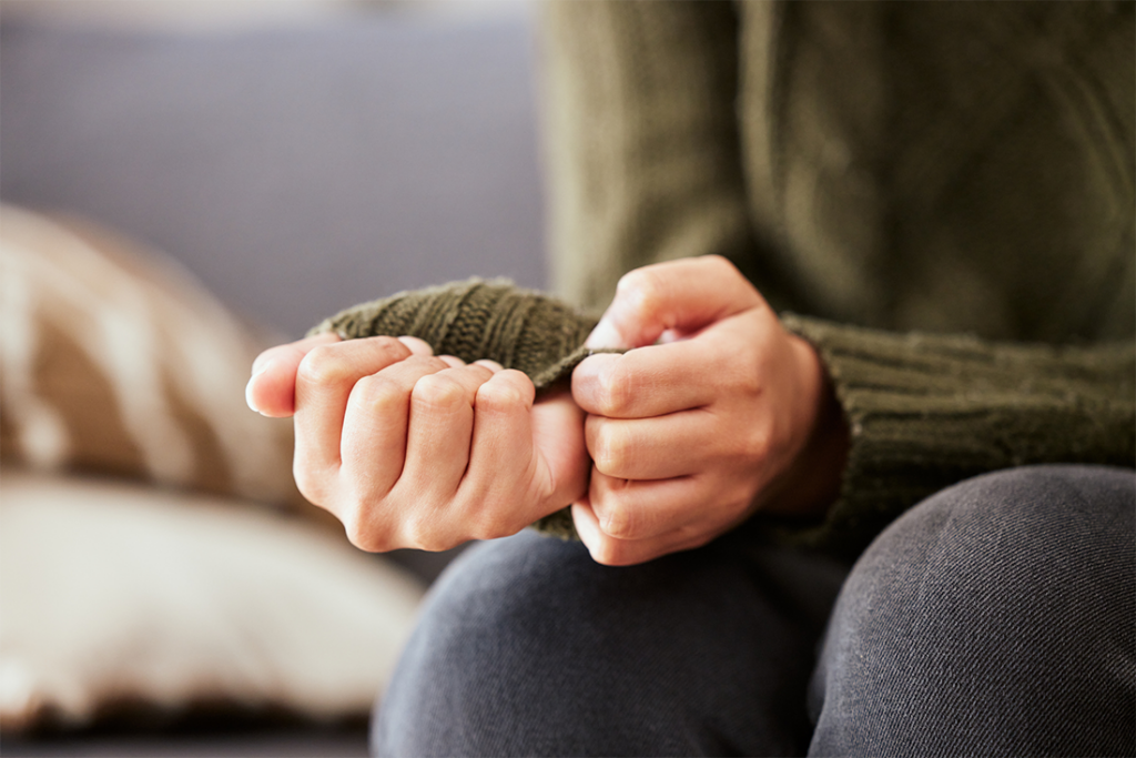 person wringing hands due to anxiety