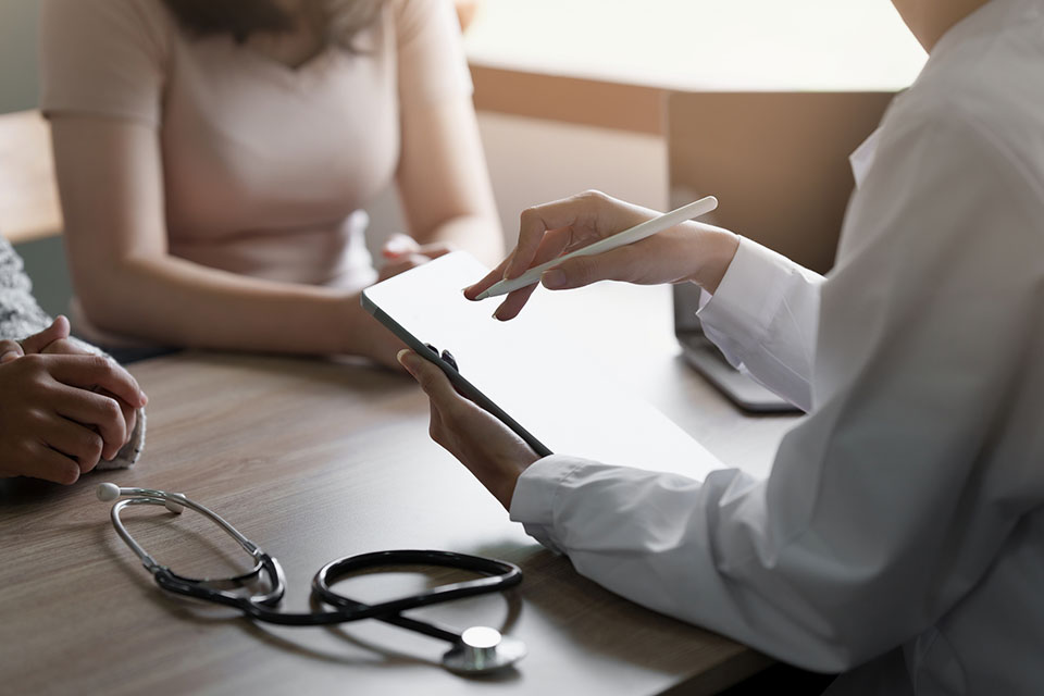 Doctor explain to patient about health care.