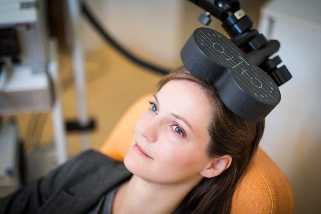 Woman receiving tms for treatment resistant depression