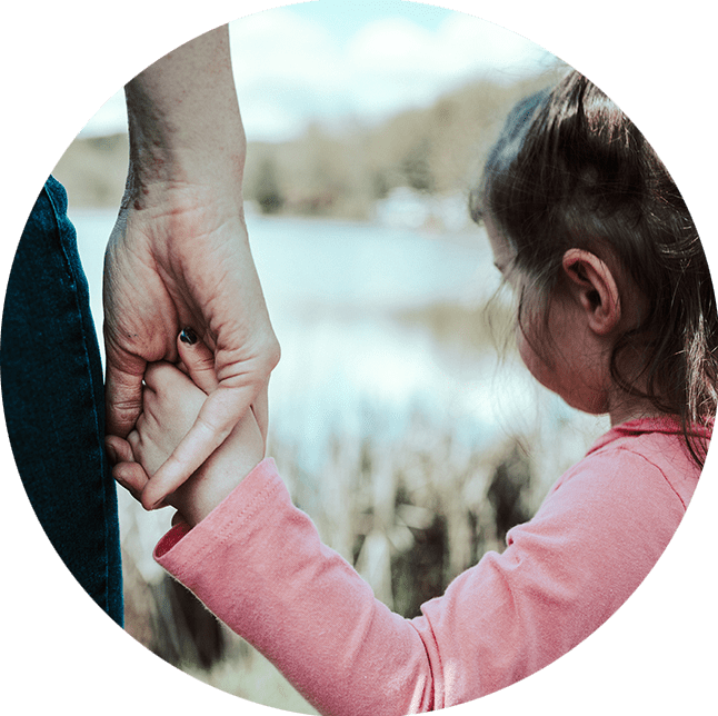 Child with autism holding father's hand